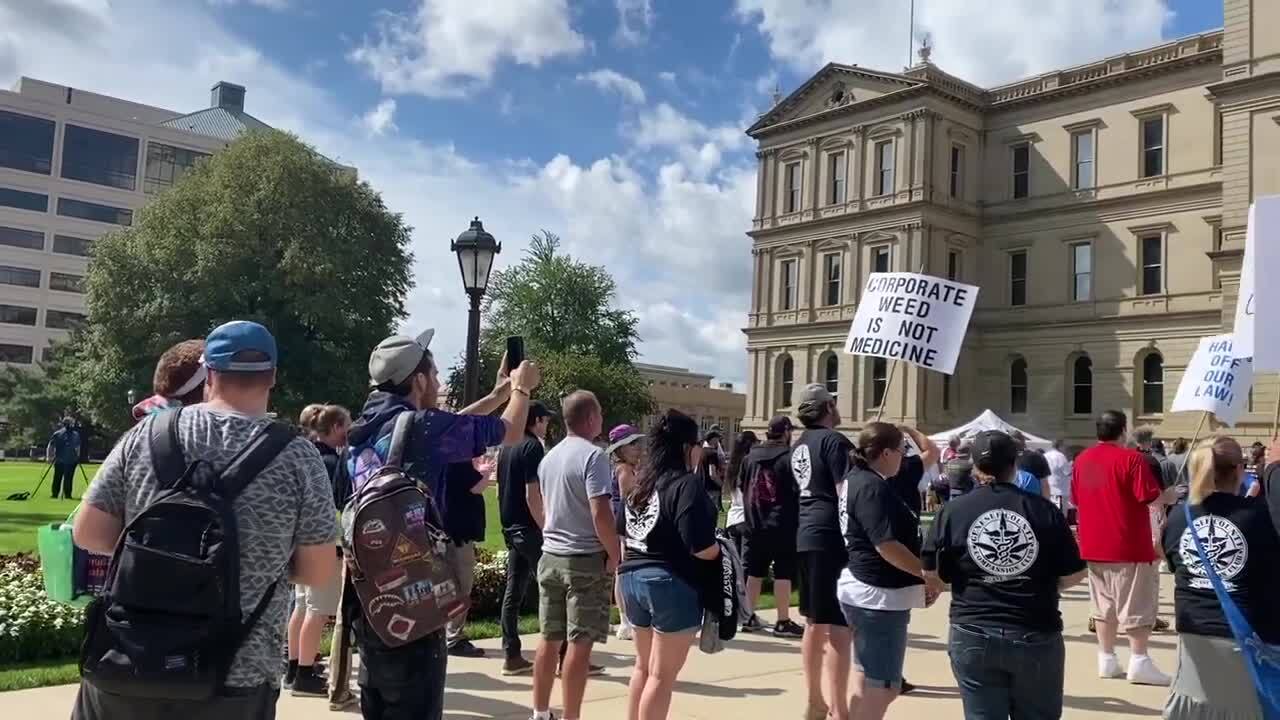 Members of Michigan Caregivers United gathered on the Capitol steps on Wednesday