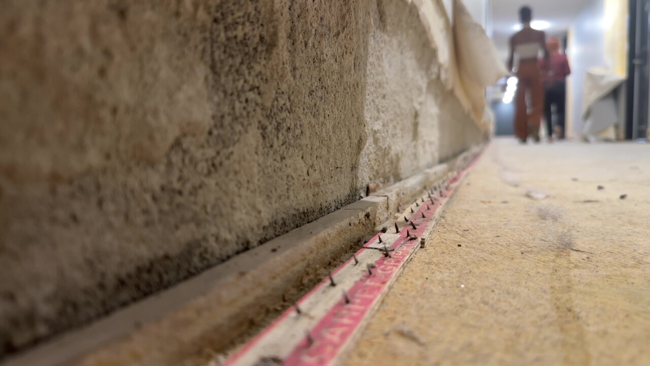 Exposed carpet tacks line the halls at the Luckman apartments.