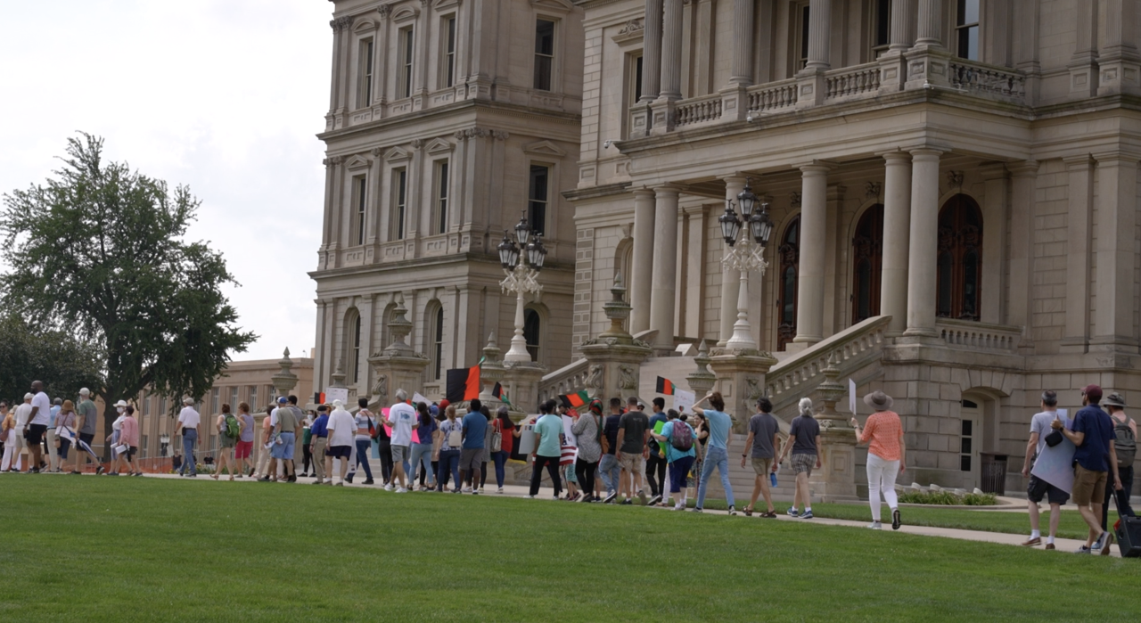 People walking to the capitol for the prayer vigil for Afghanistan.