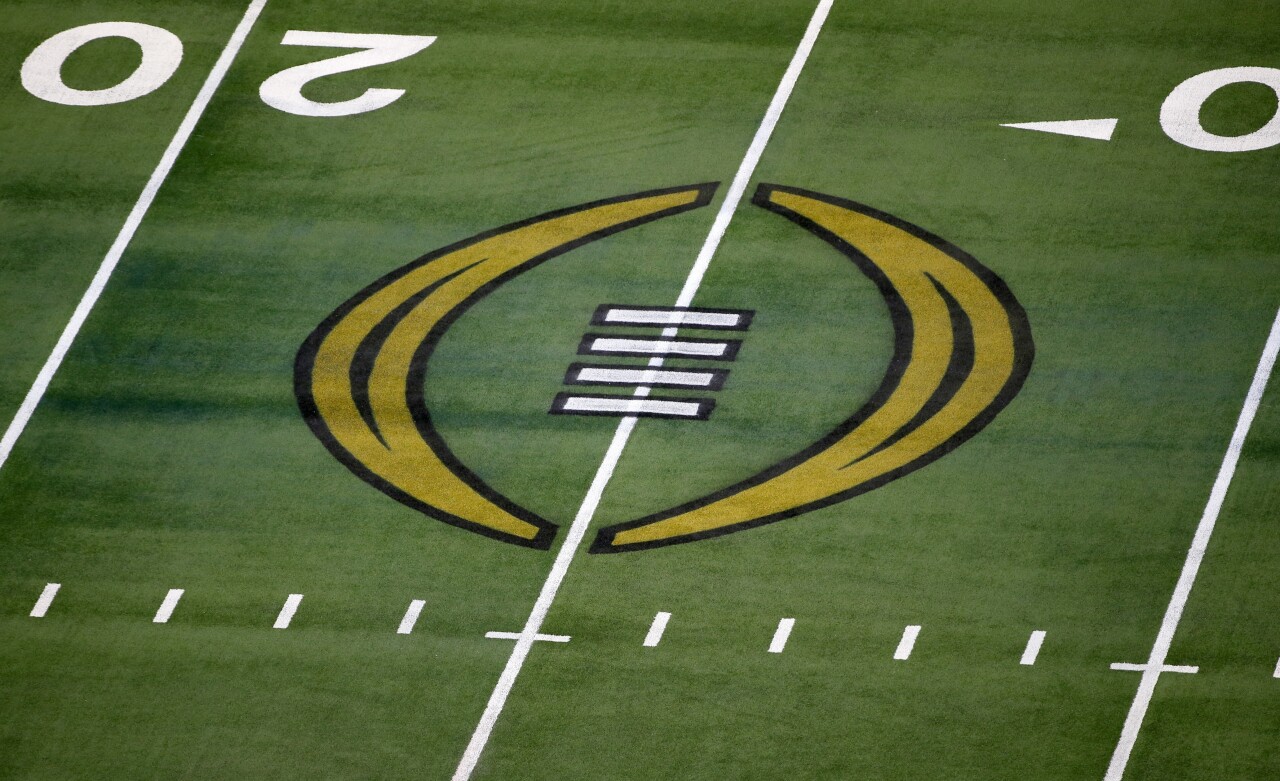 College Football Playoff logo on field at AT&T Stadium, Jan. 1, 2021