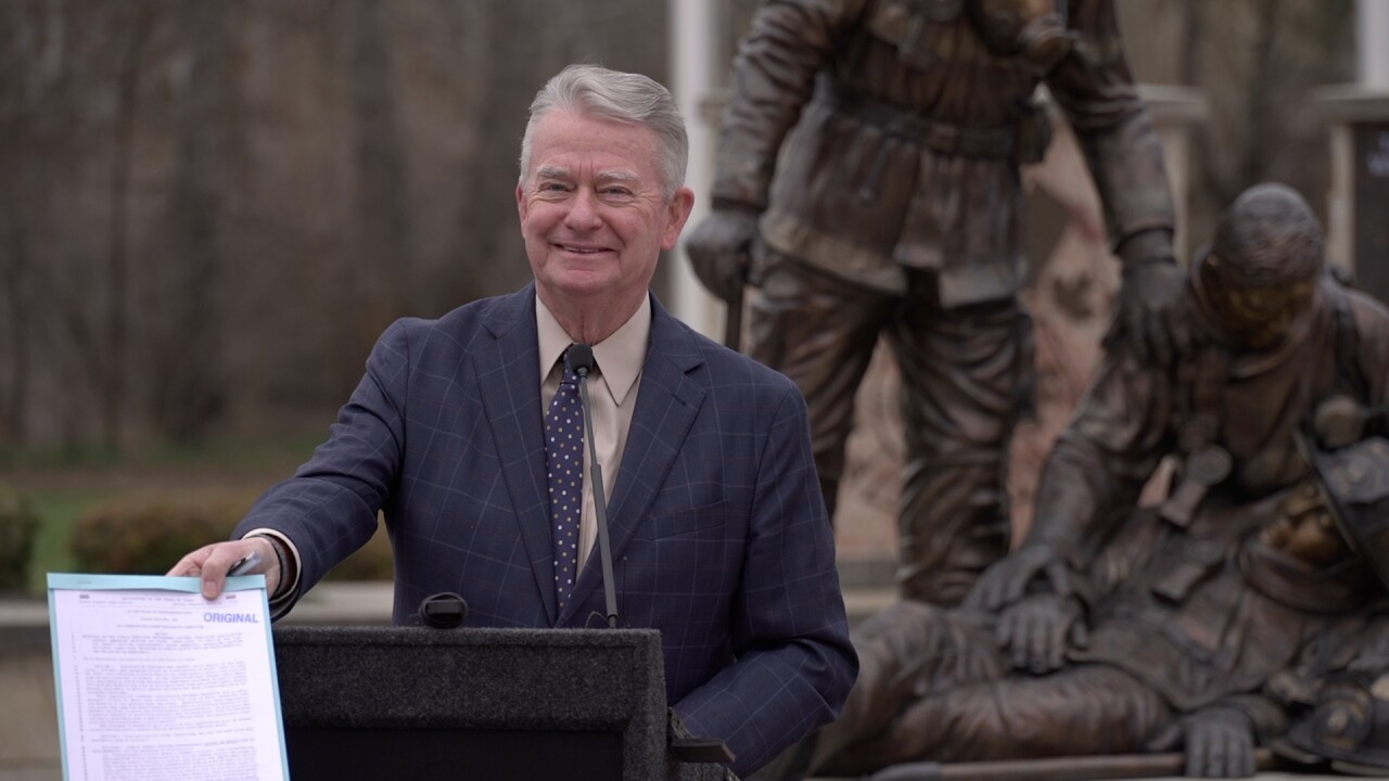 Idaho Governor Brad Little signs HB642 into law at Idaho Fallen Firefighter Memorial