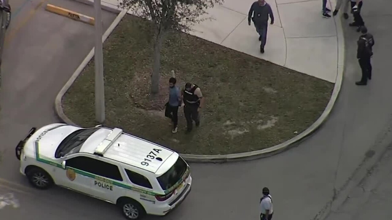 A Delray Beach bank robbery suspect is taken into custody in Miami Gardens on Feb. 1, 2022.jpg