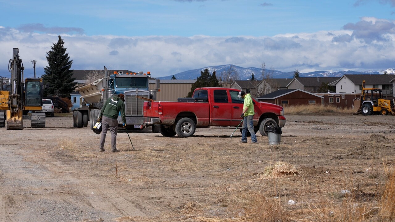 Men clearing lot