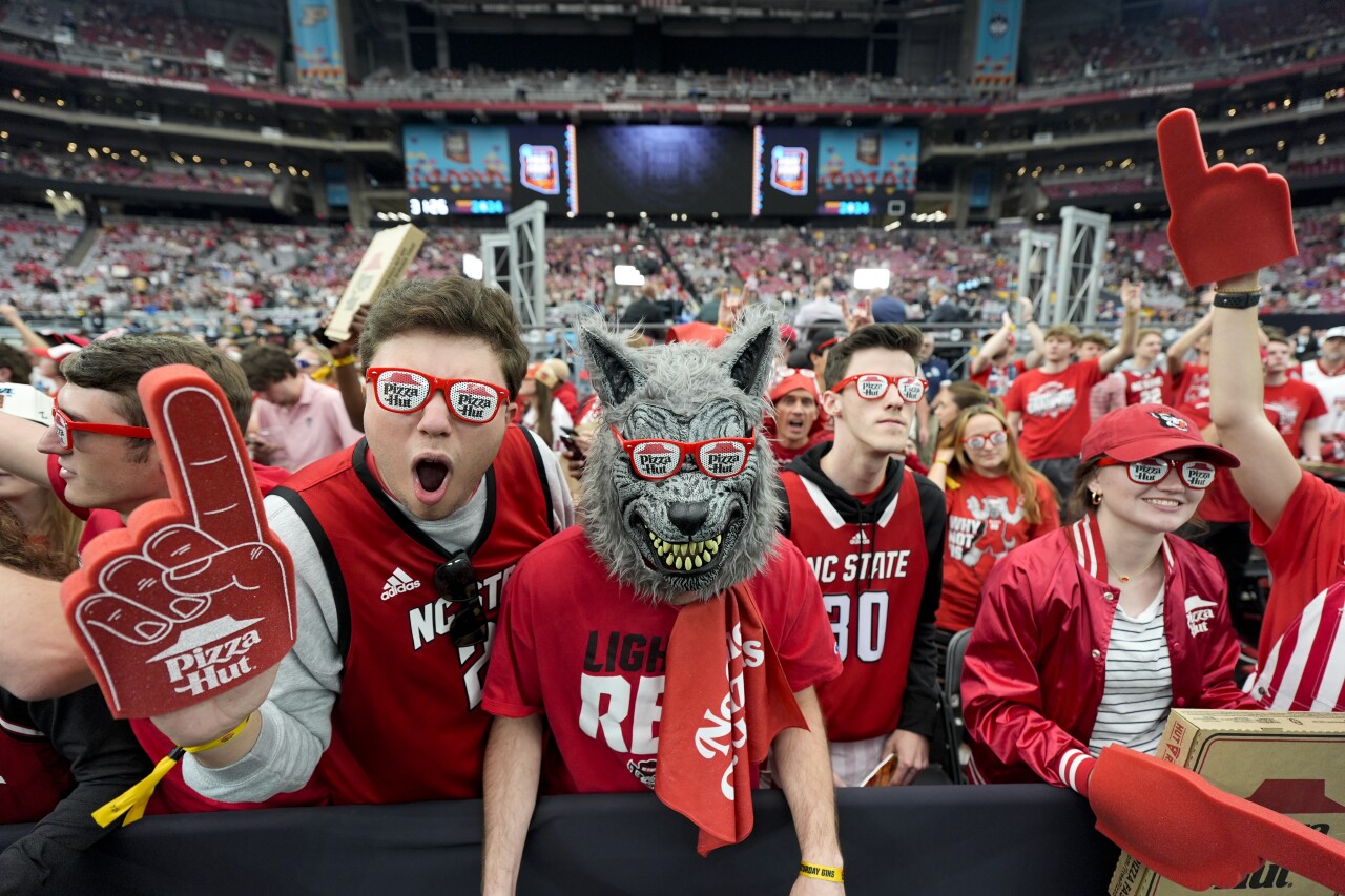 North Carolina State fans cheer before NCAA college basketball game against Purdue at the final four tournament, Saturday, April 6, 2024, at State Farm Stadium.