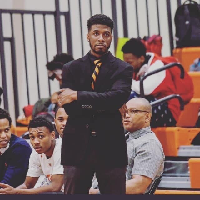 Derrick King coaching varsity basketball at Ottawa Hills High School