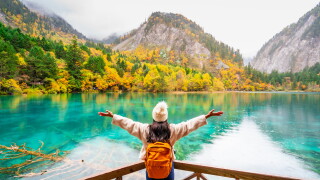 Young,Female,Tourist,Looking,At,Beautiful,Autumn,Scenery,Landscape,At
