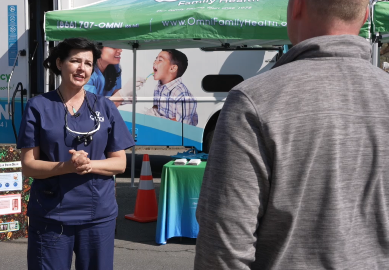 Neighborhood News Reporter Sam Hoyle interviewing Jenee Newman, Dental Quality & Outreach Supervisor for Omni Family Health