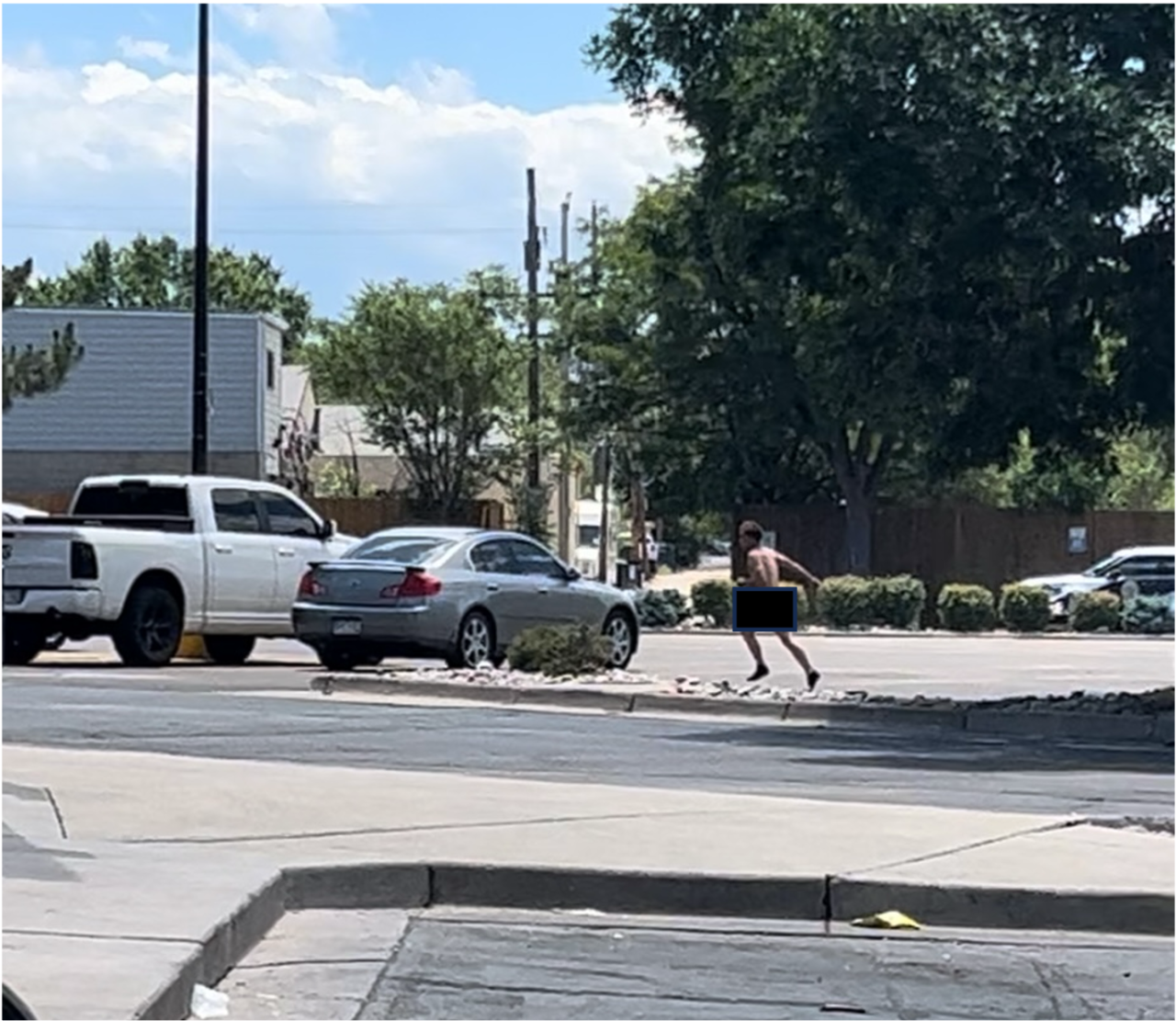 MAN IN PARKING LOT.png