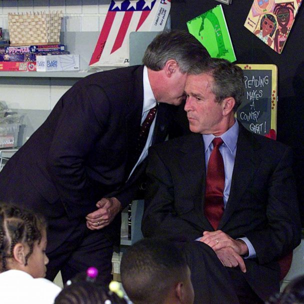 George W. Bush being told about second plane hitting World Trade Center. 