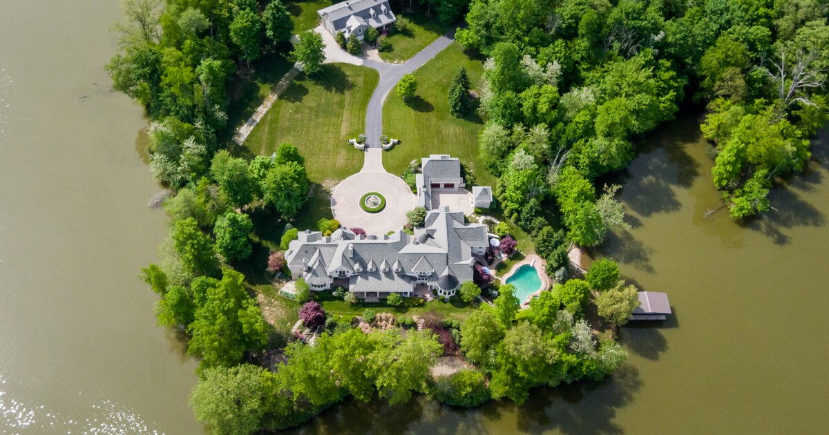 This Indiana estate up for auction features a 16000 sq ft home a swimming pool and lake views on 15 acres