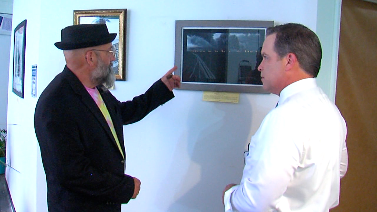 David McGee showing Craig McKee a painting