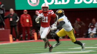 Nebraska's Emmett Johnson breaks away for a 70-yard run against Iowa in the 2025 Heroes Game