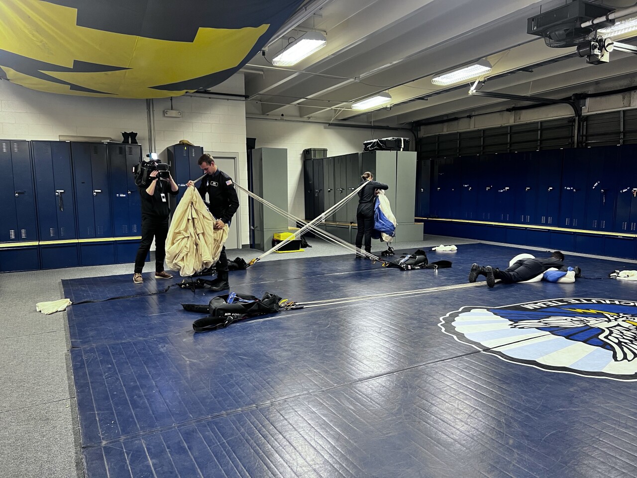 USAFA Wings of Blue Cadets preparing parachute kits