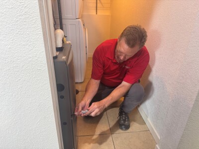 Certified inspector checks furnace during home inspection