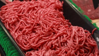 Ground beef is displayed for sale at a market.