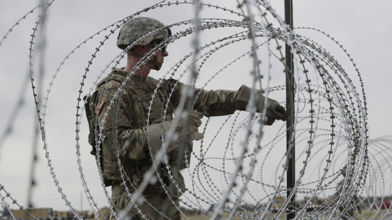 Razor wire is visible result of $210M deployment