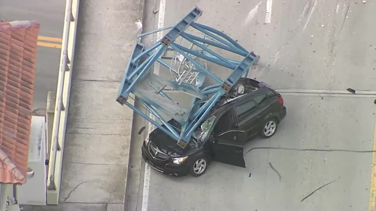 closeup of piece of crane on top of car on Fort Lauderdale bridge, April 4, 2024