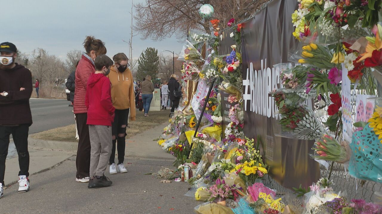 People pay their respects at the site of the Boulder mass shooting