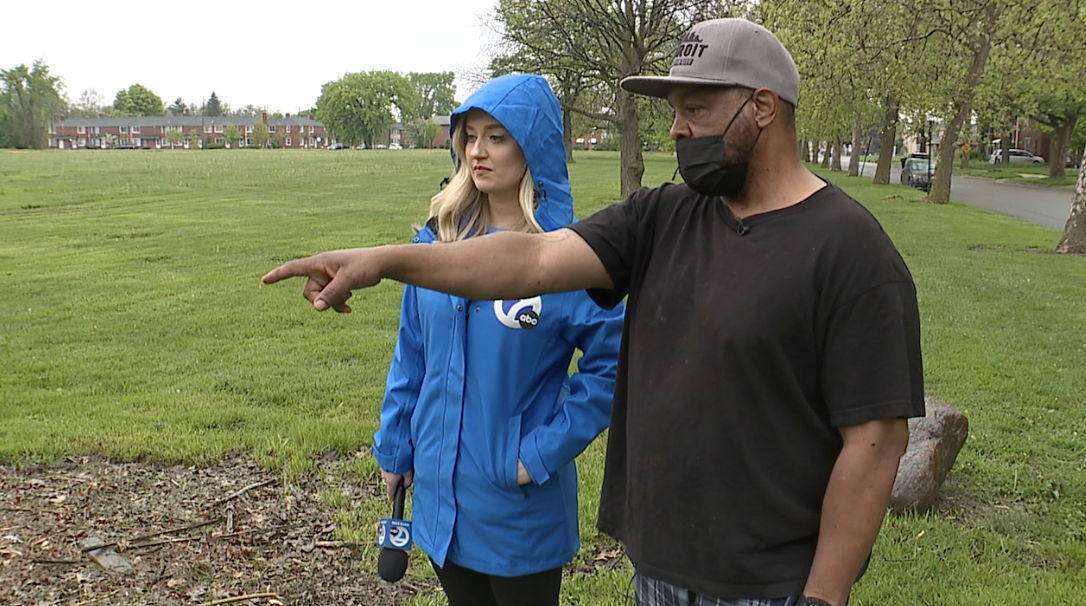 Joseph points out where he helped provide aid to one of the shooting victims at the park