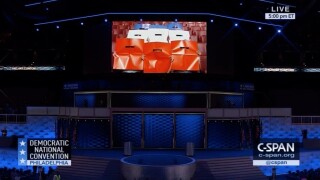 An instructional video demonstrates how Democratic National Convention audience members should hold up their cards.
