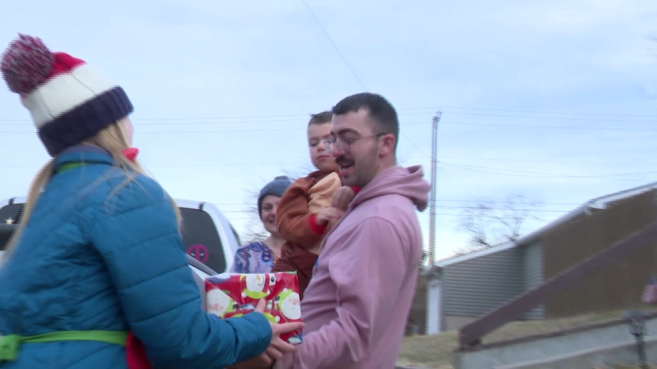 Santa Claus and helpers deliver gifts to Great Falls children