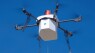 Drone delivers package to residential area