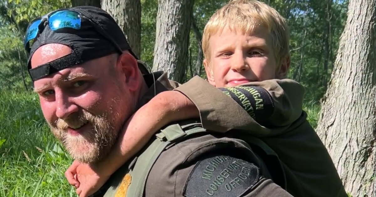 VIDEO: DNR, Michigan State Police find missing tubers in densely wooded area, give piggyback ride to boy