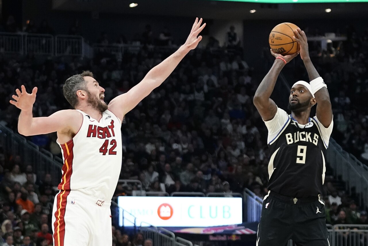 Milwaukee Bucks forward Bobby Portis shoots against Miami Heat forward Kevin Love in Game 2 of NBA first-round playoff series, April 19, 2023