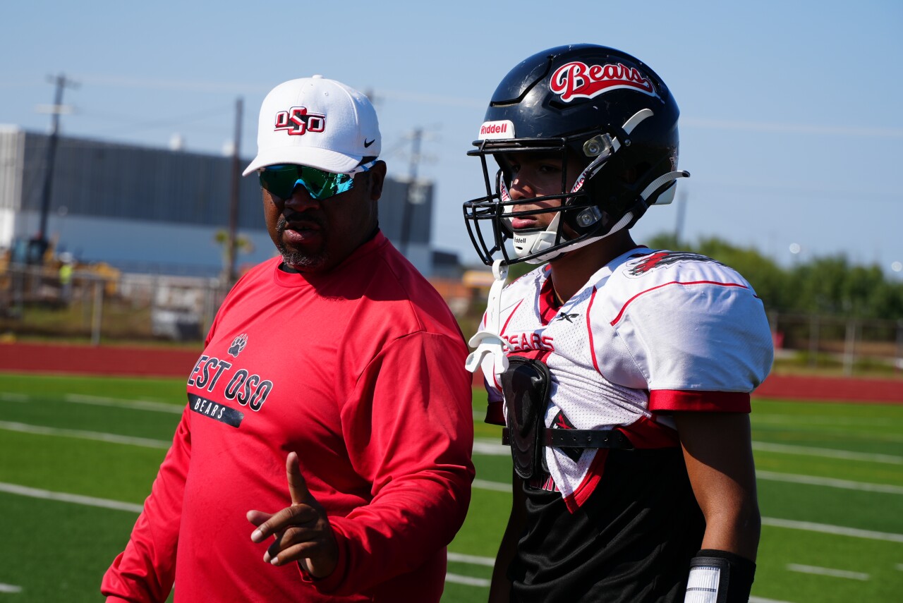 West Oso football head coach Kenneth Johnson with quarterback Ryan Guerrero