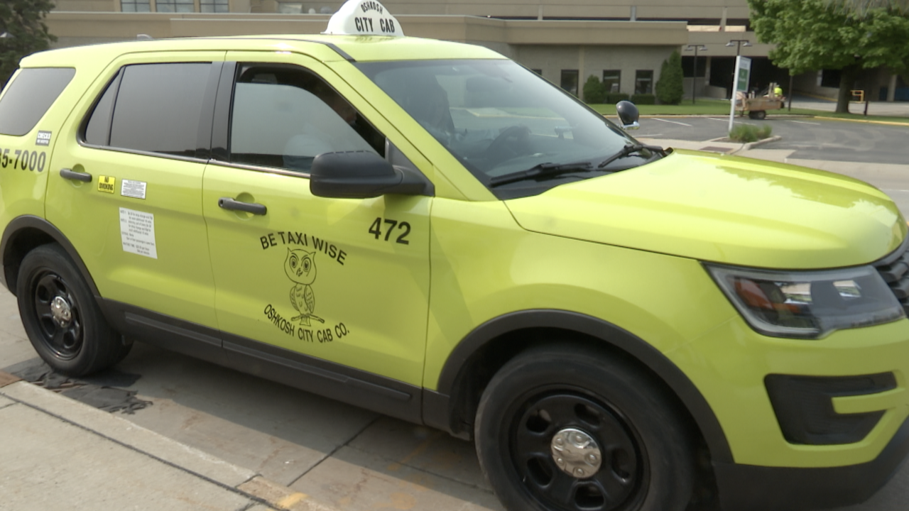 Oshkosh City Cab co. car driving for Go Transit Go Connect