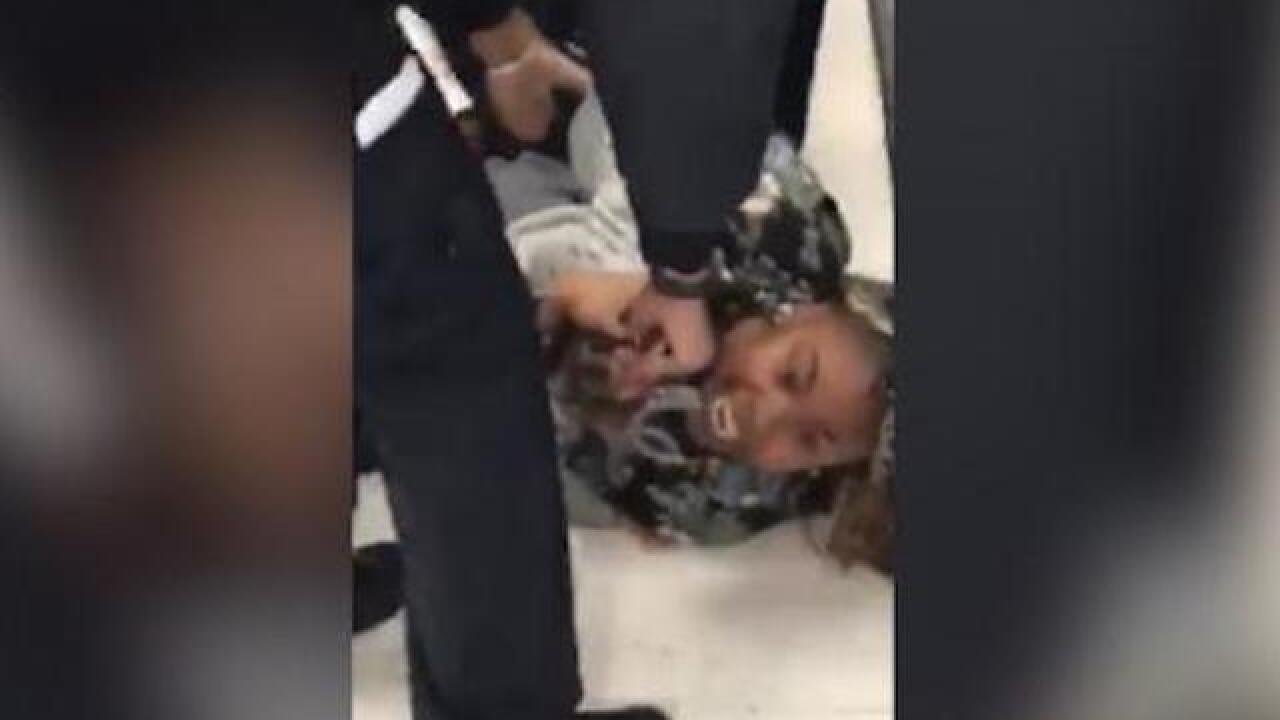 Watch: NYPD officers pry 1-year-old child from mother's arms, sparking outrage and criticism