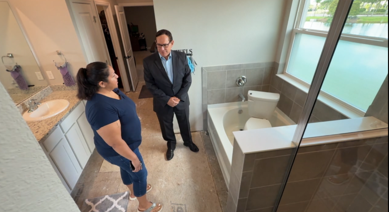 Adam and Jessica Perez in master bathroom