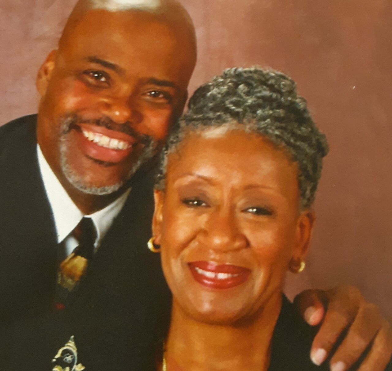 Herndon Anderson, left, smiles in an undated portrait with his smiling wife, Marilyn Anderson.