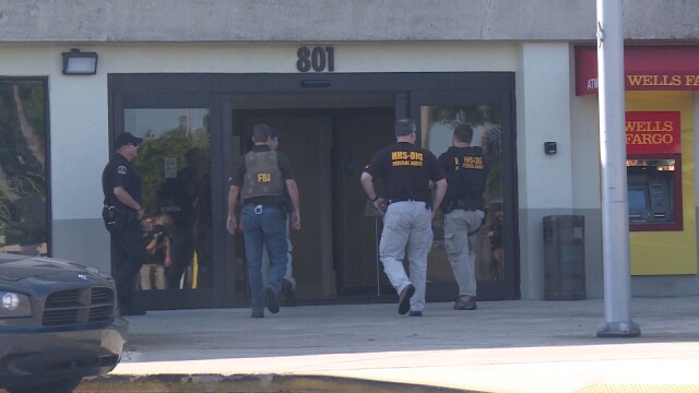Federal agents execute a search warrant at 801 W. Bay in Largo