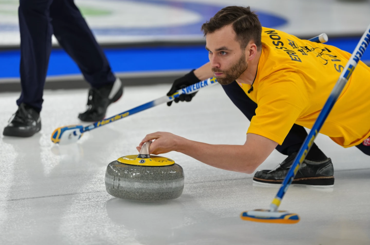 Sweden's Oskar Eriksson in action during the men's curling round robin session against Canada, at the 2026 Winter Olympics, in Cortina d'Ampezzo, Italy, Friday, Feb. 13, 2026.