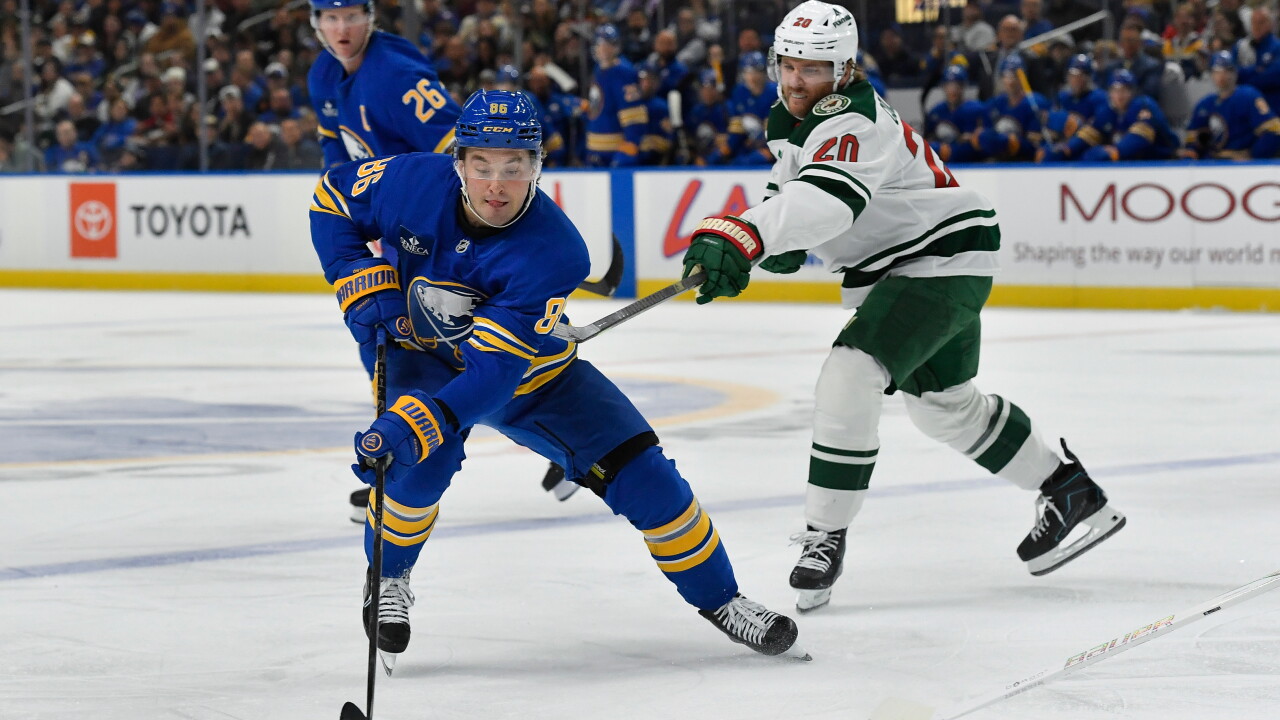 Tage Thompson skating with the puck during the Buffalo Sabres victory