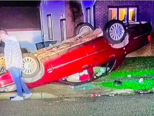 east lansing flipped car.jpeg