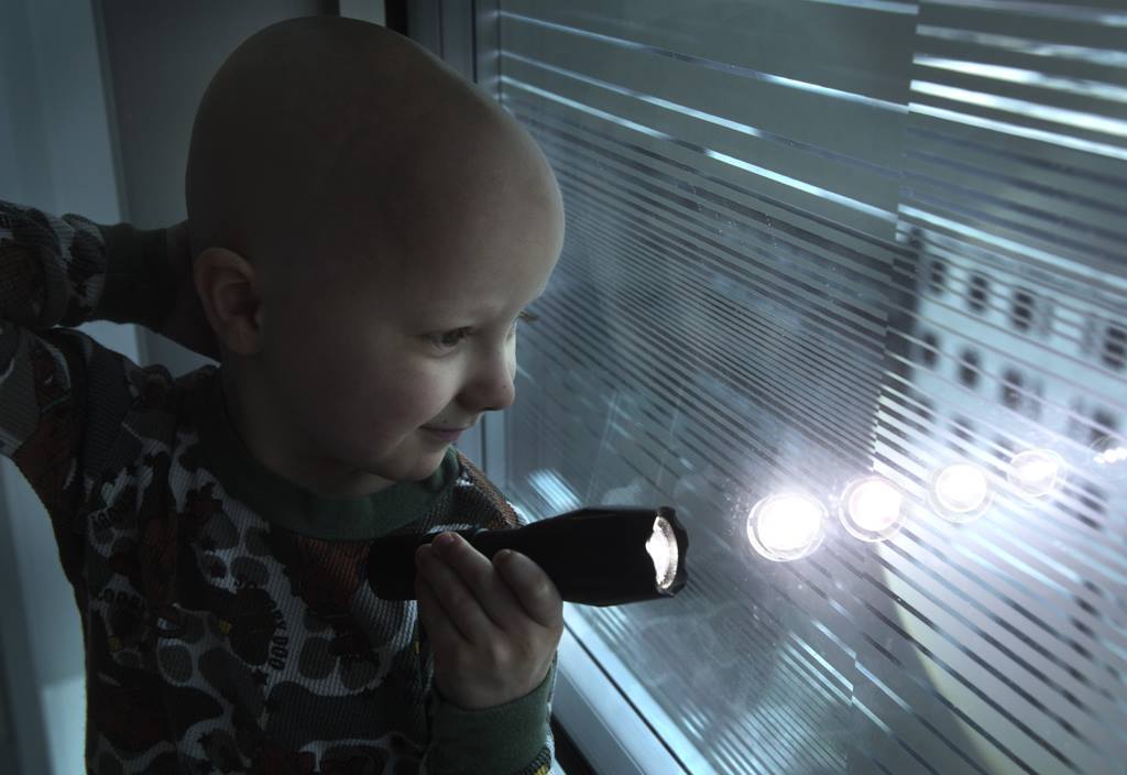 Child overlooking support of Project Night Lights