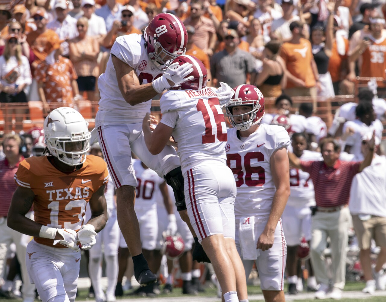 Alabama Crimson Tide kicker Will Reichard celebrates with tight end Cameron Latu after kicking game-winning FG at Texas Longhorns, Sept. 10, 2022