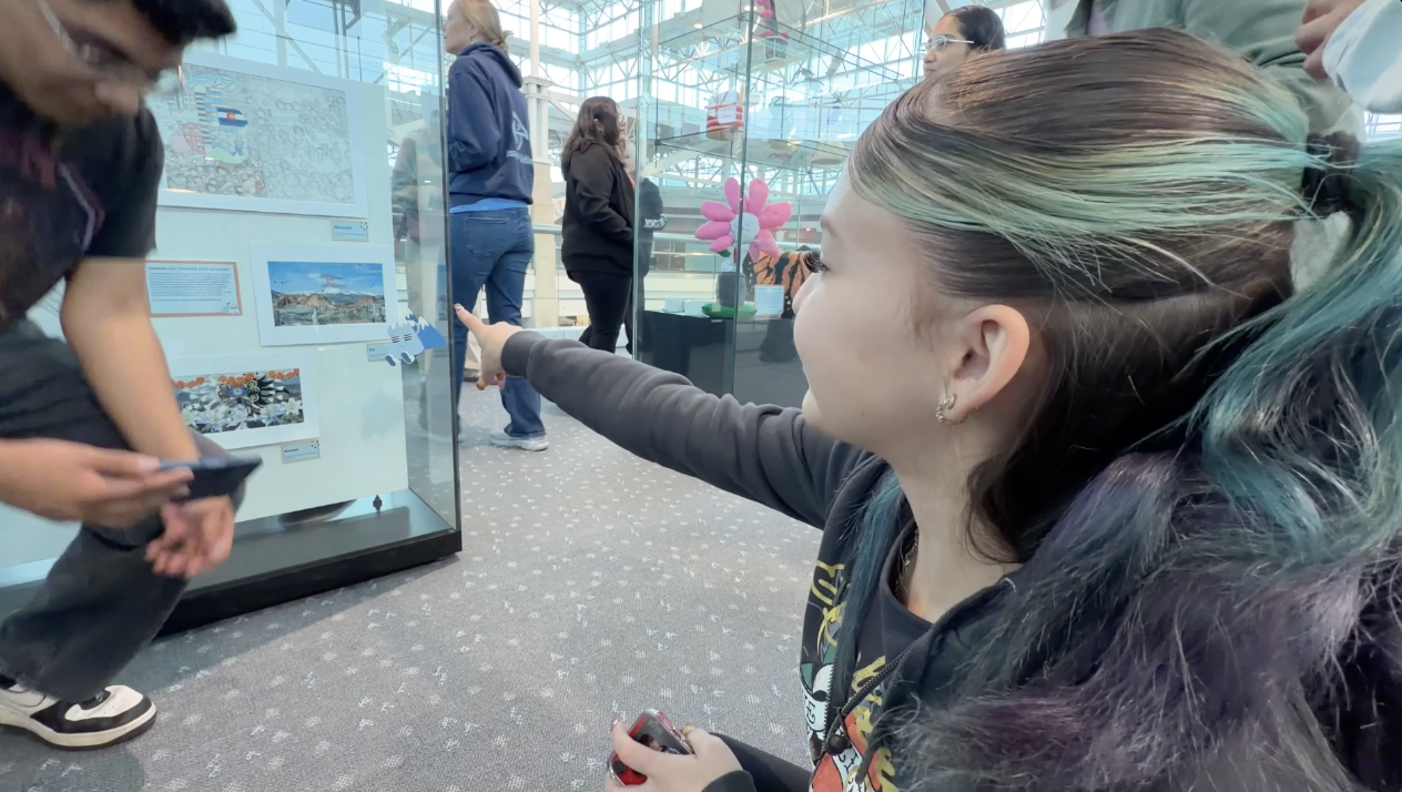 Art student Zia Kail points to her art