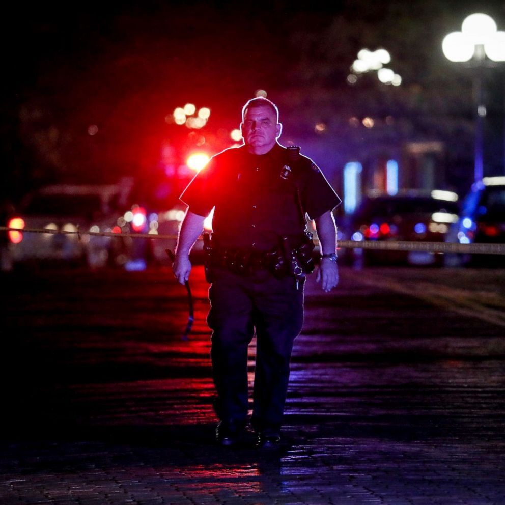 Authorities work at the scene of a mass shooting, Sunday, Aug. 4, 2019, in Dayton, Ohio (John Minchillo/AP).