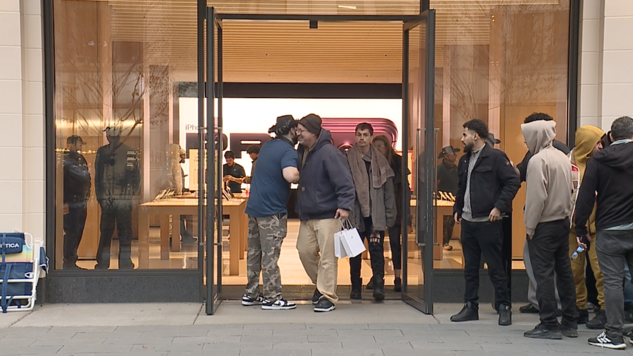 First person exits downtown Detroit Apple Store with new iPhone Duo