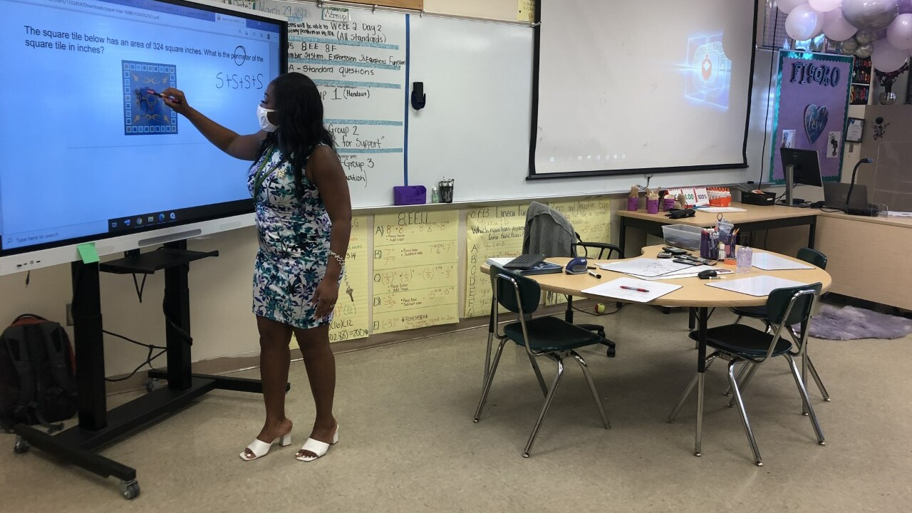 Teacher Myrlande Luctama instructs students at John F. Kennedy Middle School in Riviera Beach on March 29, 2022.jpg