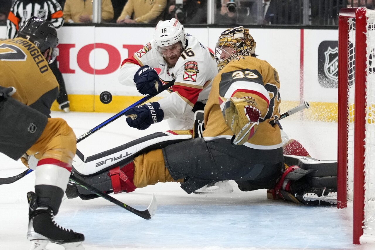 Florida Panthers center Aleksander Barkov tries to get shot past Vegas Golden Knights goaltender Adin Hill during first period of Game 5 of Stanley Cup Final, June 13, 2023