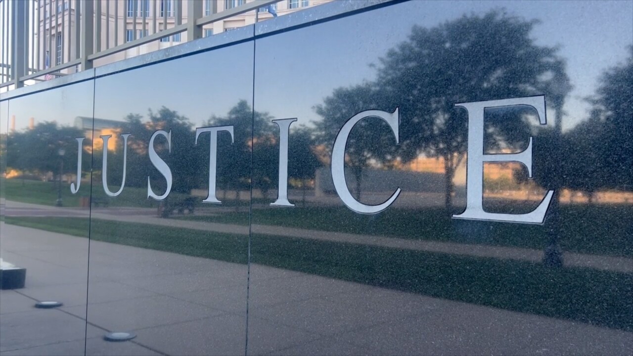 Justice sign outside the Michigan Hall of Justice
