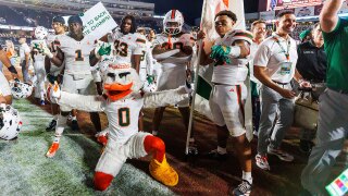 Miami players and the team mascot Sebastian the Ibis celebrate defeating Florida State in a NCAA college football game, Saturday, Oct. 4, 2025, in Tallahassee, Fla.