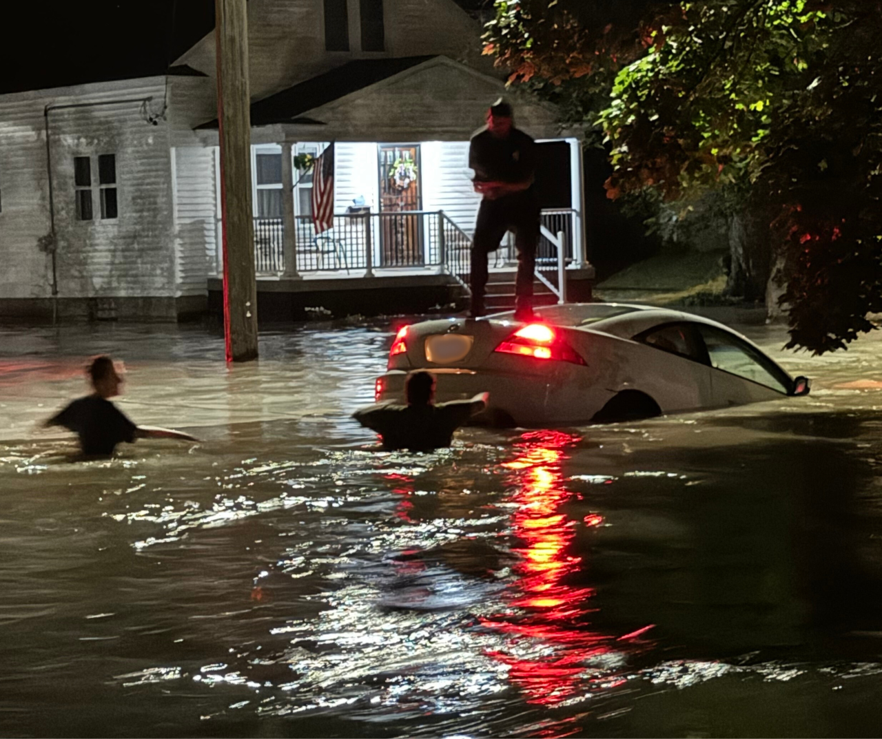 Man rescued from car washed down road - Southeast Grand Rapids neighborhood flooded by water main break