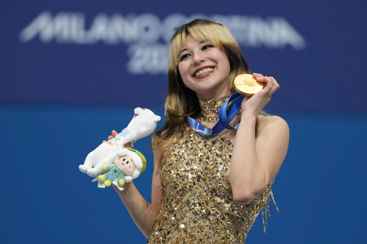 Gold medalist Alysa Liu of the United States displays her medal after competing in the women's free skate program in figure skating at the 2026 Winter Olympics, in Milan, Italy, Thursday, Feb. 19, 2026.