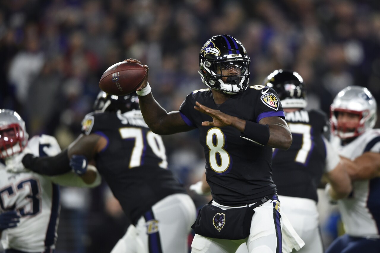 Baltimore Ravens QB Lamar Jackson throws vs New England Patriots in 2019
