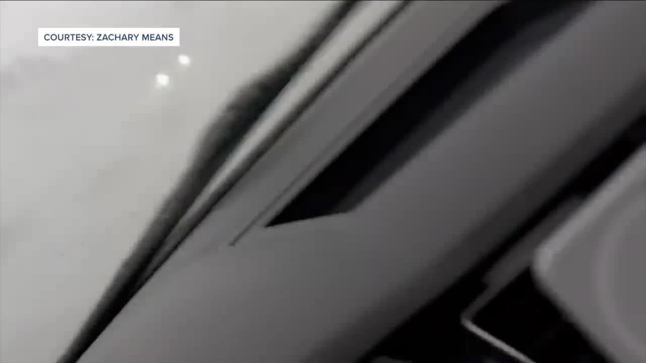 Zach Means cellphone video of car flipping over in tornado